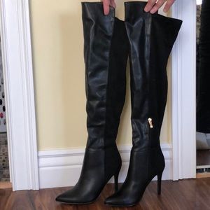 Black satin/velvet high heel boots.